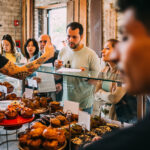guests lined up at the republique pastry case