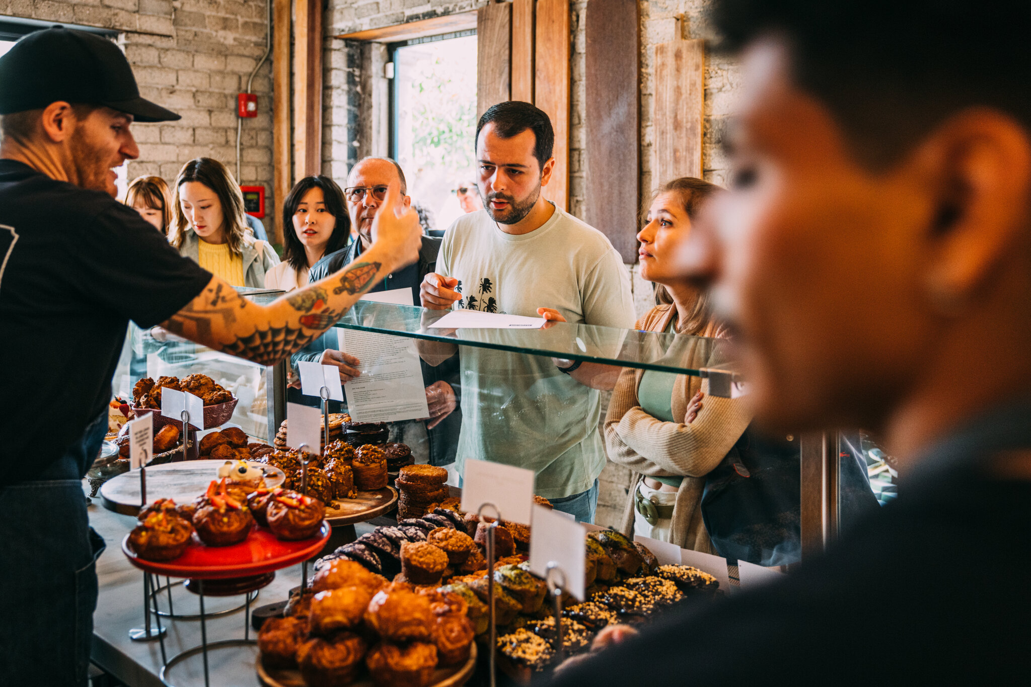 guests lined up at the republique pastry case